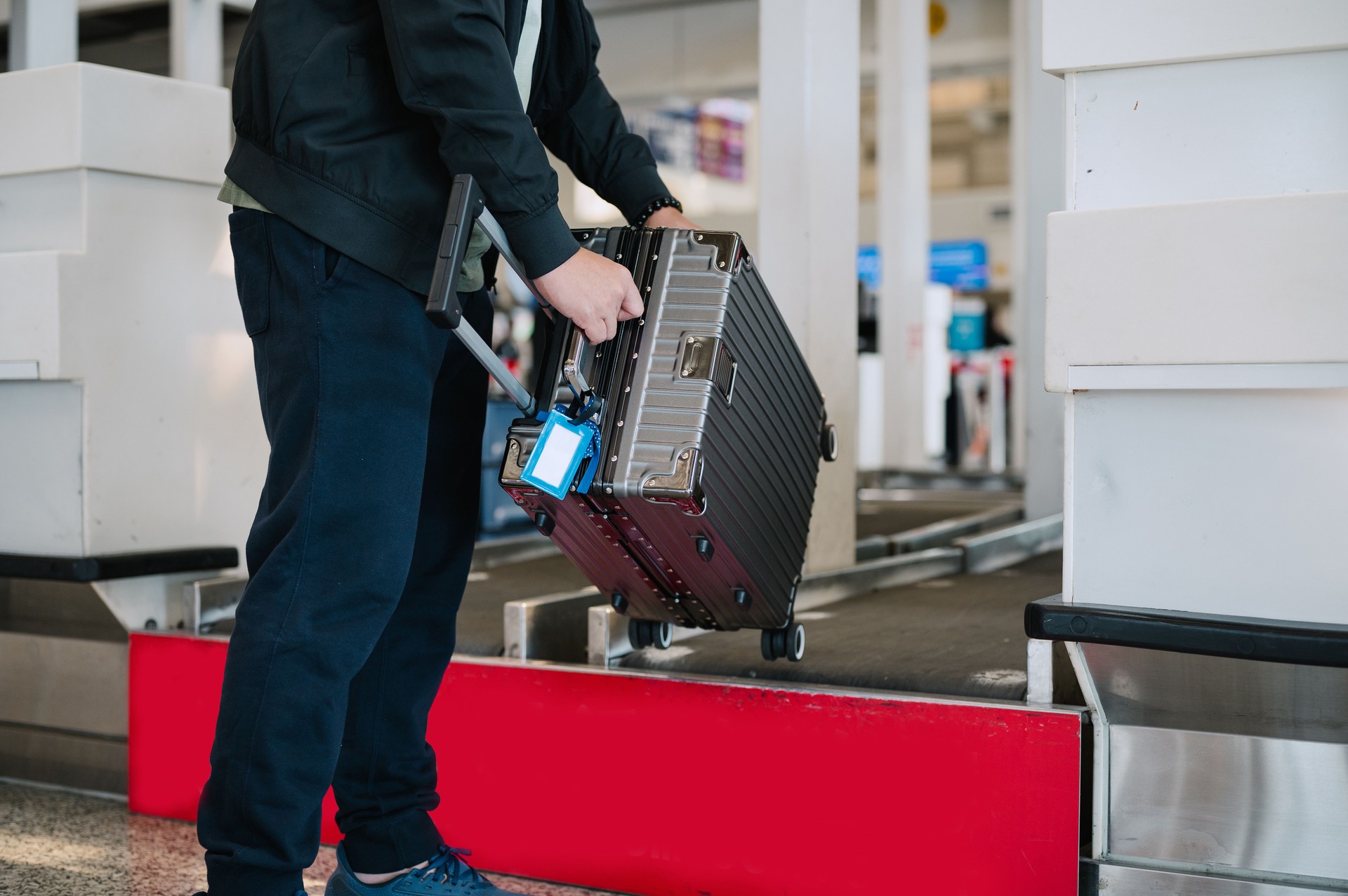 Businessman check in luggage at check in counter